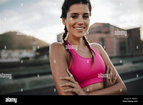 Healthy Young Female Runner Standing Outdoors In Morning Woman In