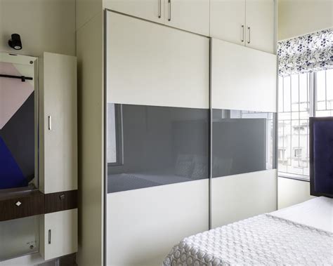 Sliding Bedroom Wardrobe Design With Loft Storage Livspace