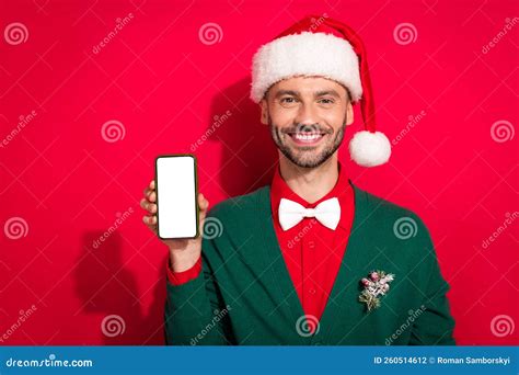 Photo Of Positive Cute Man Wear X Mas Bowtie Green Cardigan Rising Apple Samsung Modern Device