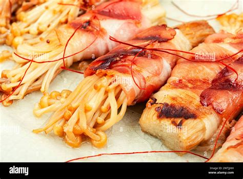 Enoki Or Enokitake Mushroom Roasted In Bacon On Plate Bacon Wrapped