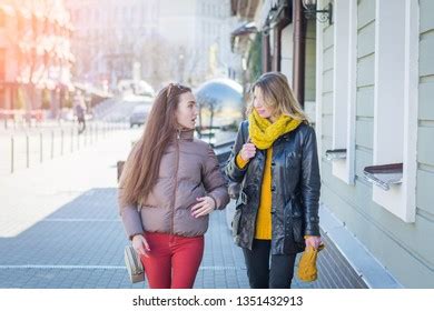 Back View Two Friends Walking Together Stock Photo 1351432913