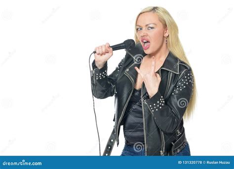 Portrait Of A Beautiful Woman In Leather Jacket Singing With Microphone