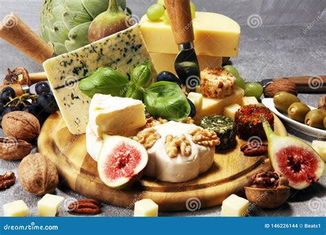 Cheese Plate Served with Figs, Various Cheese on a Platter on Wood ...