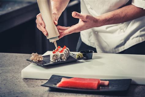 Premium Photo | Chef preparing sushi in the kitchen