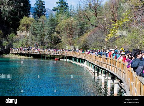 Five-Coloured pool, Crowd on footbridge, Jiuzhaigou National Park, Sichuan Province, China ...