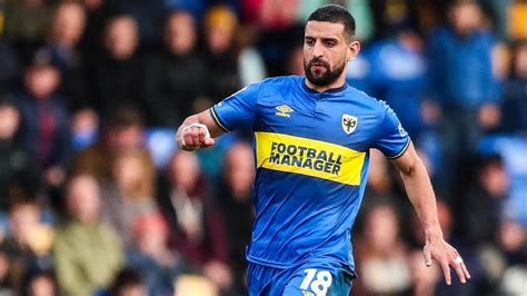 Omar Bugiels Header Gives Afc Wimbledon Victory Over Nine Man Salford