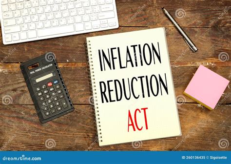 Notebook With Inflation Reduction Act Concept Near Calculator And