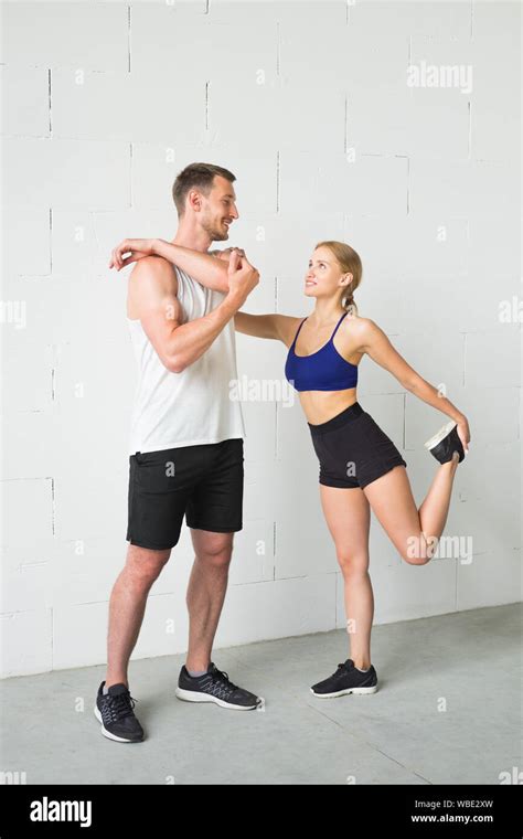 Sport Couple Man And Woman After Fitness Exercise On The White