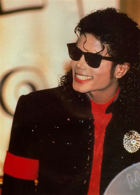 Michael Jackson Wearing Sunglasses And A Red Shirt