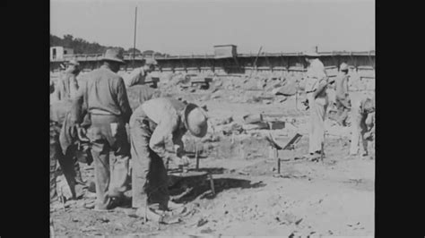 Workers prep up for dynamite explosion at Wheeler dam construction site ...