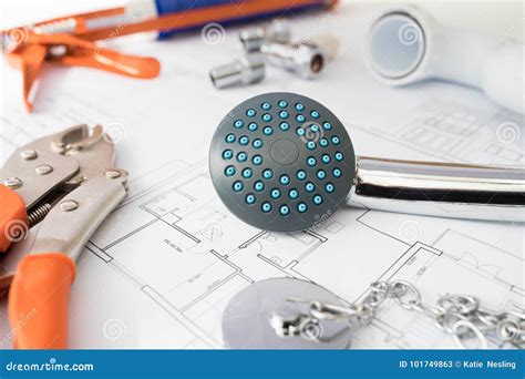 Plumbing Tools And Components Arranged On House Plans Stock Image