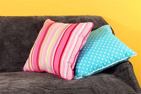 Premium Photo Colorful Pillows On Couch On Yellow Background