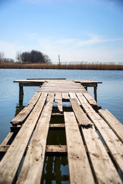 Premium Photo Pier Over Lake Against Sky