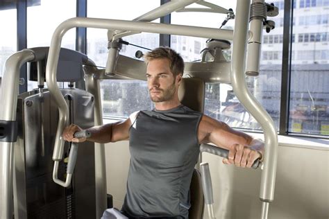 How To Use A Chest Press Machine Benefits And Variations