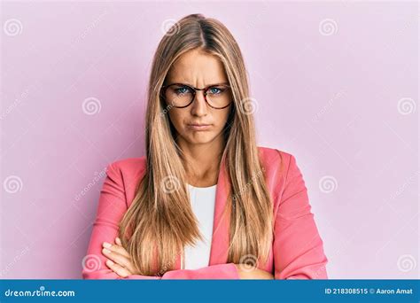 Young Blonde Woman Wearing Business Style And Glasses Skeptic And Nervous Disapproving