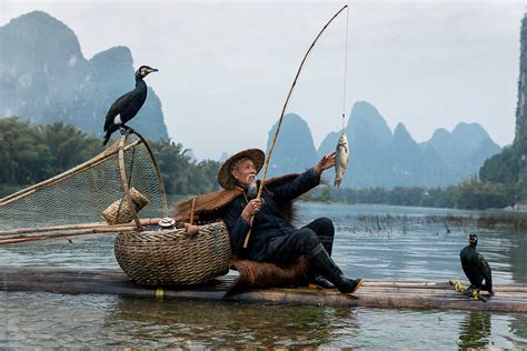 "Chinese Traditional Fisherman" by Stocksy Contributor "Bisual Studio" - Stocksy