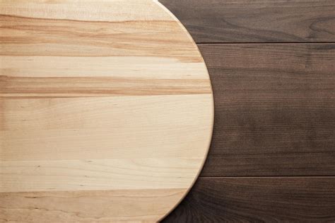 Premium Photo | Wooden round board for pizza