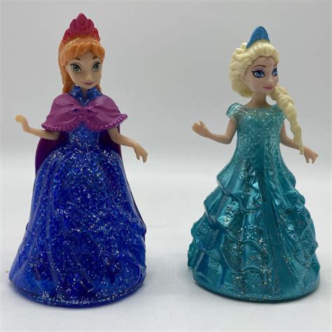 Disney Frozen Anna Elsa Glitzer Glider Kleider Magic Clip Puppen