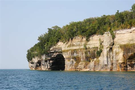 Kayakers At A Sea Cave At The Lokrum Island In Croatia Stock Photo