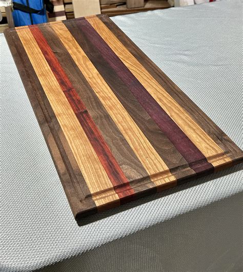 Walnut Oak Paduk And Purple Heart Edge Grain Cutting Board With