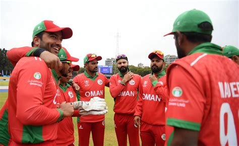 The Oman Players Get Into A Huddle Before The Start Of Play