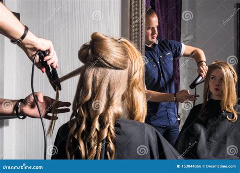 Young Woman Doing Hair Styling In The Salon Stock Photo Image Of