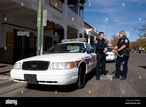 Santa Fe: police patrol car, policeman & policewoman Stock Photo - Alamy