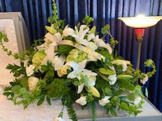 White Casket Spray - Fisher Funeral Home & Cremation Services