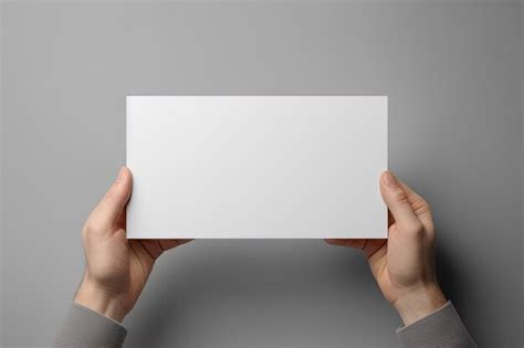 Premium Ai Image A Human Hand Holding A Blank Sheet Of White Paper Or