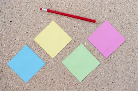 Premium Photo Blank Sticky Notes With A Pencil On A Corkboard Background