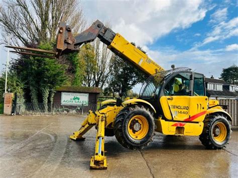 NEW HOLLAND LM1440 4WD TELEHANDLER 14 METER REACH C W PALLET TINES