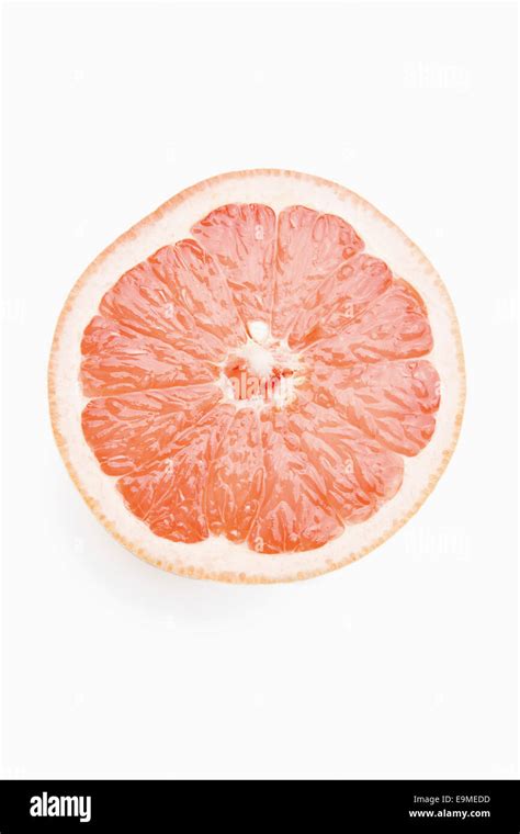 Cross Section Of Grapefruit Against White Background Stock Photo Alamy