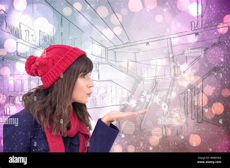 Festive Brunette Blowing A Kiss Against Light Glowing Dots On Purple