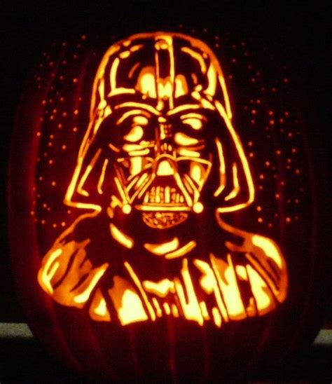 a star wars pumpkin carved to look like darth vader