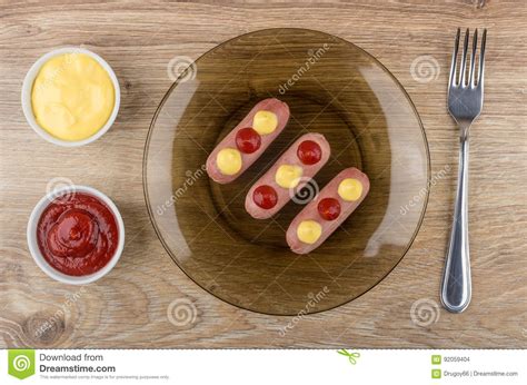 Boiled Sausages With Sauces In Plate Ketchup And Mayonnaise Stock