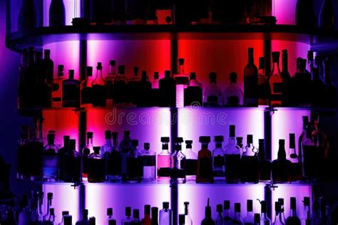 A Lot Of Alcohol Bottles In A Modern Bar Pub Background With Drink