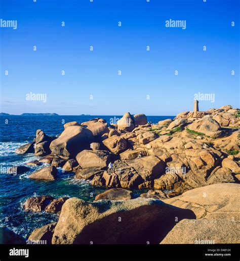 Rocks and boulders and Mean Ruz lighthouse Ploumanach Côte de granite