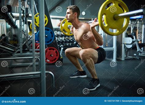 Handsome Man Squatting With Barbell Stock Image Image Of Strong