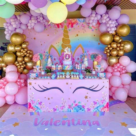 A Unicorn Themed Birthday Party With Balloons And Decorations