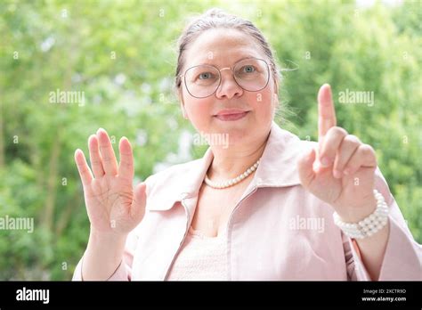Mature Businesswoman In Glasses Elegant Independent Woman Years Old In Pink Blazer Pointing