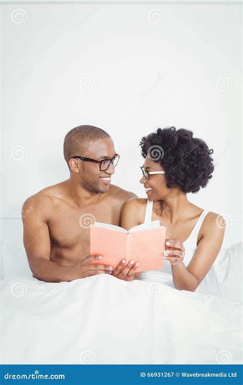 Happy Couple Reading A Book Together Stock Image Image Of Leisure