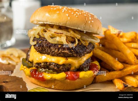 Homemade Chicago Big Baby Cheeseburger With Pickles And Onions Stock
