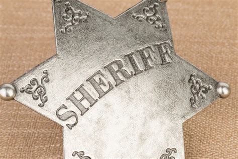 Sheriff Badge On Black Leather Texture Background — Stock Photo