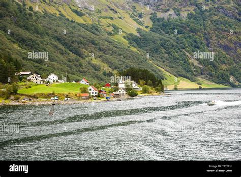 Landscape With Naeroyfjord Mountains And Traditional Village Houses In