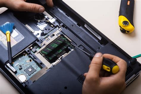 Premium Photo The Wizard Restores The Laptop Disassembly Of The Laptop Into Spare Parts Board