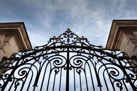 Premium Photo Wrought Iron Gate And Stone Pillars In Saint Emilion