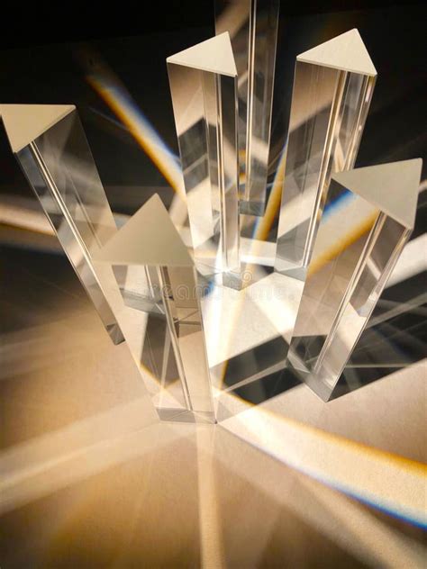 Two Triangular Glass Cube Prisms Refract Natural Light Into Shade And