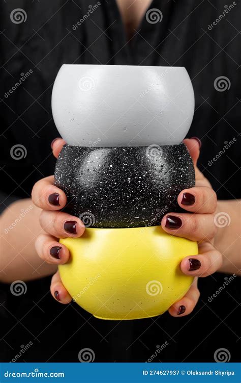 Three Pots Of Different Colors In A Woman S Hand Stock Image Image Of