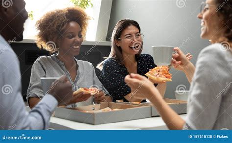 Joyful Friendly Multicultural Team Having Fun Eating Pizza Together