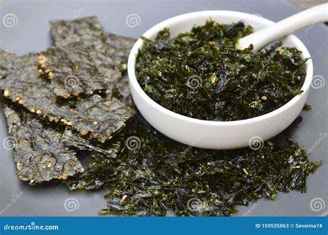 Salty Roasted Dried Seaweed Nori With Sesame Seeds In A White Bowl On A